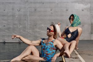 Dancers Joel Bray and Zoe Brown-Holten pose languidly in old fashioned bikinis by the MPavilion pond